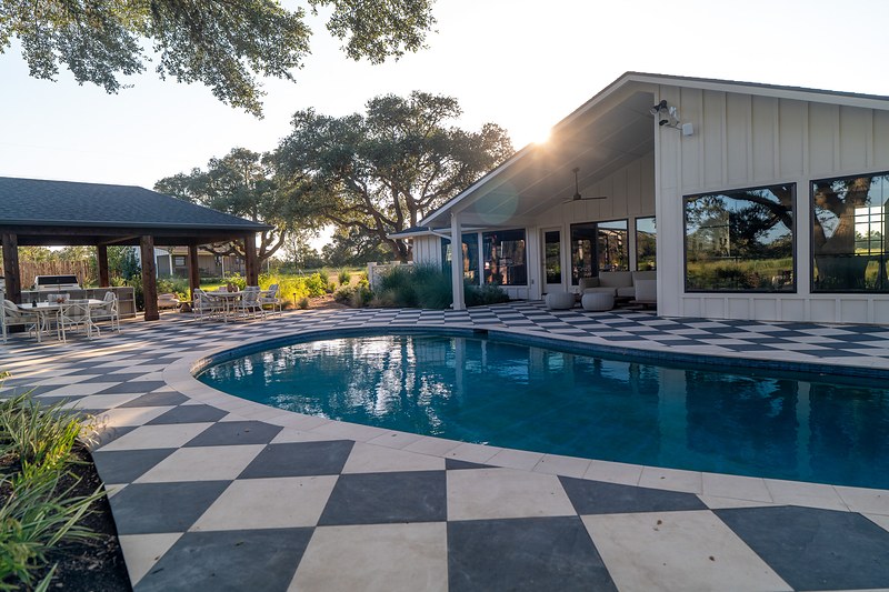 The pool, patio, and main house at Stardust Ranch, Texas